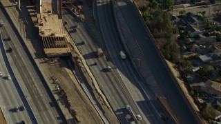 AX64_0002E - 5K aerial stock footage of light traffic on I-5 / 170 freeway split in Pacoima, California