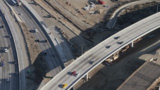 AX64_0003 - 5K aerial stock footage of Interstate 5 / Highway 170 freeway split with light traffic, Pacoima, California