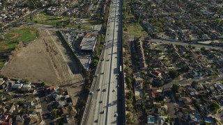 AX64_0004E - 5K aerial stock footage of Highway 170 freeway traffic through residential neighborhoods, North Hollywood, California