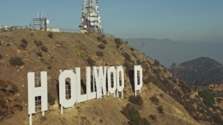AX64_0018 - 5K aerial stock footage of flying by the iconic Hollywood Sign in Los Angeles, California