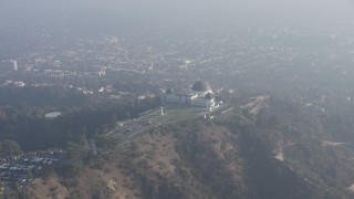 AX64_0019 - 5K aerial stock footage of Griffith Observatory in haze, Los Angeles, California