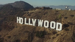 AX64_0021 - 5K aerial stock footage approach and fly over the Hollywood Sign, Los Angeles, California