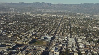 AX64_0026 - 5K aerial stock footage pan across suburban neighborhoods to reveal the Burbank Airport, California