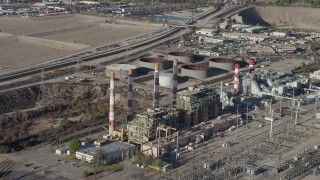 AX64_0038 - 5K aerial stock footage of LADWP Valley Generating Station smoke stacks, Sun Valley, California