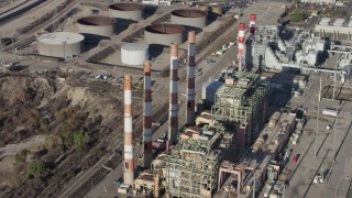 AX64_0039 - 5K aerial stock footage of smoke stacks at the LADWP Valley Generating Station in Sun Valley, California