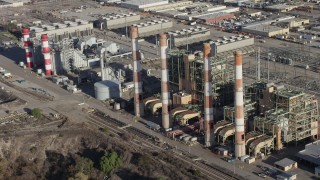 AX64_0040 - 5K stock footage aerial video flyby smoke stacks at the LADWP Valley Generating Station in Sun Valley, California