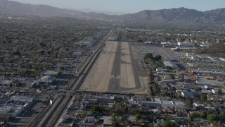 AX64_0041 - 5K aerial stock footage of approaching runway at Whiteman Airport, Pacoima, California