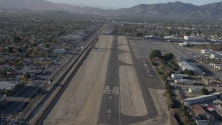 AX64_0042 - 5K aerial stock footage of descending toward the runway at Whiteman Airport, Pacoima California