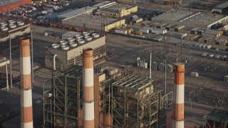 AX64_0051 - 5K aerial stock footage of LADWP Valley Generating Station smoke stacks and power plant buildings, Sun Valley, California