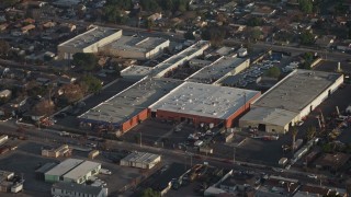 AX64_0053E - 5K aerial stock footage approach a group of warehouse buildings in Sun Valley, California
