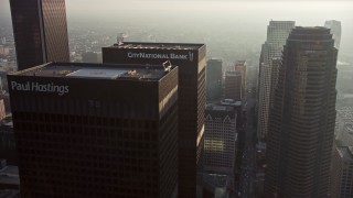 AX64_0087E - 5K aerial stock footage of flying by Downtown Los Angeles skyscrapers, California