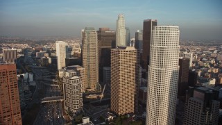 AX64_0092E - 5K aerial stock footage approach and fly over tall skyscrapers in Downtown Los Angeles, California