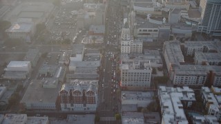 AX64_0118 - 5K stock footage aerial video of malls and theaters on Hollywood Boulevard, Hollywood, California, Sunset