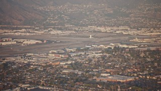 AX64_0131E - 5K aerial stock footage of Bob Hope International Airport in Burbank, California, sunset