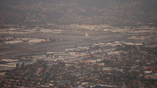 AX64_0132 - 5K aerial stock footage flyby Bob Hope International Airport, Burbank, California, sunset