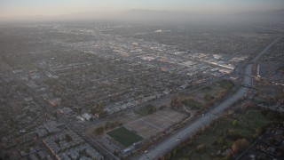 AX64_0133 - 5K aerial stock footage of Highway 170 and Sherman Way Square mall in North Hollywood, California, sunset