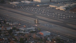 AX64_0138 - 5K aerial stock footage of airport control tower at Whiteman Airport, Pacoima California, sunset