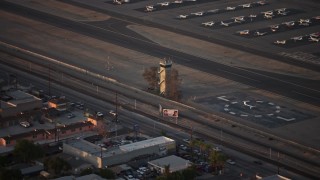 AX64_0138E - 5K aerial stock footage of airport control tower at Whiteman Airport, Pacoima California, sunset