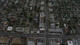AX64_0151E - 5K aerial stock footage bird's eye view of suburban neighborhoods near Tujunga Wash in Van Nuys, California twilight