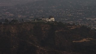 AX64_0169 - 5K aerial stock footage approach the Griffith Observatory at twilight, Los Angeles, California