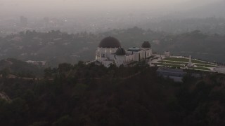 AX64_0172 - 5K aerial stock footage flyby the east side of the Griffith Observatory, Los Angeles, California, twilight