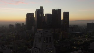 AX64_0192 - 5K aerial stock footage flyby the top of City Hall for a view of Downtown Los Angeles skyline, California, twilight