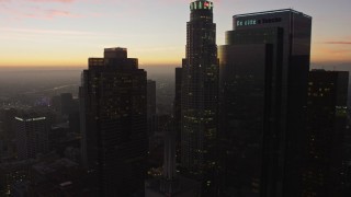 AX64_0193E - 5K aerial stock footage of Downtown Los Angeles' tall skyscrapers at twilight, California