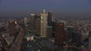 AX64_0204E - 5K aerial stock footage of Staples Center arena and The Ritz-Carlton hotel, reveal Downtown Los Angeles, California, twilight