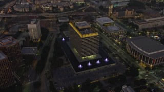 AX64_0210E - 5K aerial stock footage of LADWP office building and concert halls, Downtown Los Angeles, California, twilight