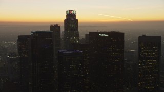 AX64_0212E - 5K aerial stock footage of US Bank Tower and skyscrapers, Downtown Los Angeles, California, twilight
