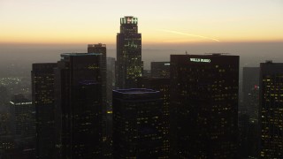 AX64_0213 - 5K aerial stock footage of Downtown Los Angeles skyscrapers around US Bank Tower, California, twilight