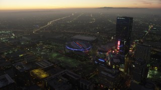 AX64_0217 - 5K stock footage aerial video of Staples Center arena, Nokia Theater, and The Ritz-Carlton in Downtown Los Angeles, California, twilight