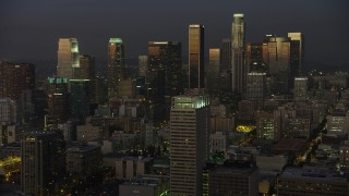 AX64_0228 - 5K aerial stock footage of Downtown Los Angeles skyscrapers reflecting the twilight light, California
