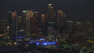AX64_0237E - 5K aerial stock footage of Downtown Los Angeles hotels and skyscrapers, California, twilight