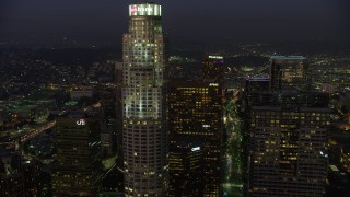 AX64_0249 - 5K aerial stock footage flyby US Bank Tower in Downtown Los Angeles, California, twilight