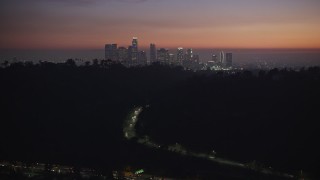 AX64_0256E - 5K aerial stock footage of Downtown Los Angeles skyline at twilight, California