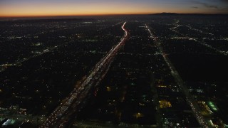 AX64_0275 - 5K aerial stock footage of heavy traffic on Interstate 10 through Pico-Union, Los Angeles, California, twilight