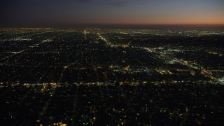 AX64_0279 - 5K aerial stock footage of West Adams neighborhood around Crenshaw Boulevard in Los Angeles, California, night