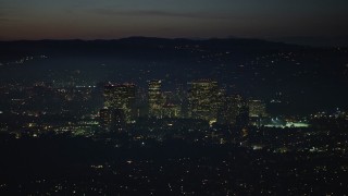 AX64_0284 - 5K aerial stock footage of passing Century City skyscrapers at night, Los Angeles, California