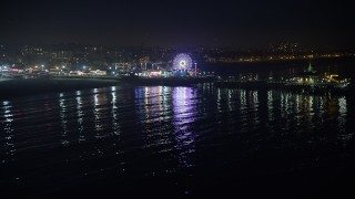 AX64_0306 - 5K aerial stock footage approach the Pacific Wheel at Santa Monica Pier, Los Angeles, California, night