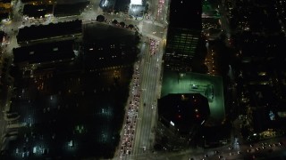 AX64_0319 - 5K aerial stock footage of bird's eye of Wilshire Boulevard through Westwood, Los Angeles, California, night