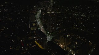 AX64_0321 - 5K aerial stock footage of Wilshire Boulevard and condo complexes in Westwood, Los Angeles, California, night