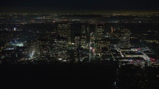 AX64_0322E - 5K aerial stock footage of passing by Century City skyscrapers, Los Angeles, California, night