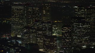 AX64_0324 - 5K aerial stock footage of reverse view of Century City Skyscrapers, Los Angeles, California, night