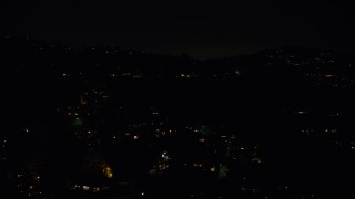 AX64_0331 - 5K stock footage aerial video of residential lights from hillside mansions in Hollywood Hills, Los Angeles, California, night