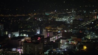 AX64_0334 - 5K aerial stock footage of Roosevelt Hotel and office buildings on Hollywood Boulevard, Hollywood, California, night