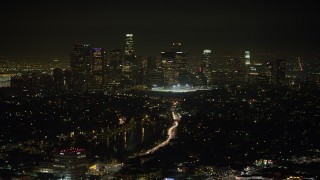 AX64_0348 - 5K aerial stock footage of Downtown Los Angeles skyline viewed from Echo Lake, California, night