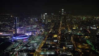 AX64_0362 - 5K aerial stock footage of Downtown Los Angeles skyscrapers, reveal Staples Center, California, night