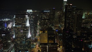AX64_0365 - 5K aerial stock footage of towering Downtown Los Angeles skyscrapers at night, California