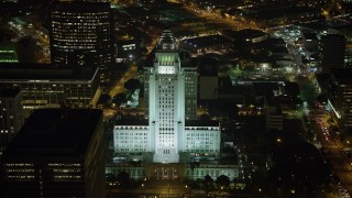 AX64_0368 - 5K aerial stock footage of Los Angeles City Hall at night, Downtown Los Angeles, California